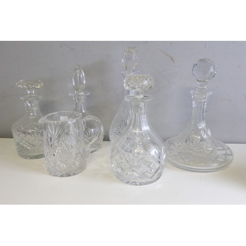 550 - Selection of cut glass decanters and a jug