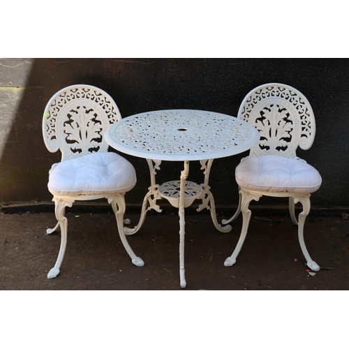 5 - Metal painted circular garden table and two chairs.