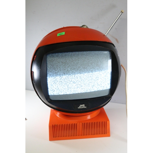 56 - A vintage JVC space helmet television and base missing visor