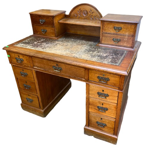 65 - Antique kneehole desk with raised drawer back measures approx 107cm W x 60cm D x 102cm H