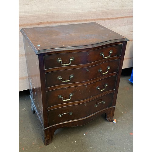 74 - Reproduction mahogany serpentine chest.