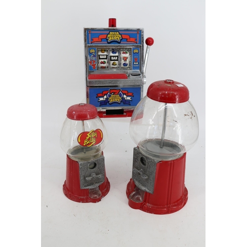 81 - A gumball machine, Jelly Bean machine and novelty slot machine.