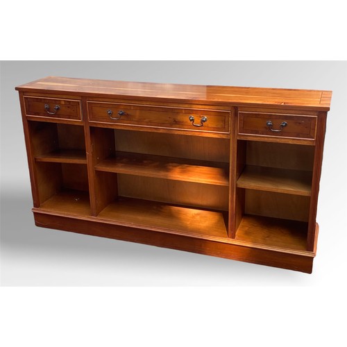 85 - Reproduction open bookcase fitted three top drawers and adjustable open shelves.