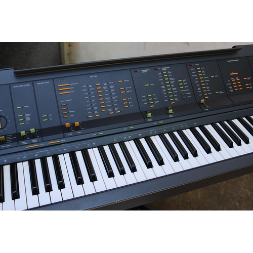 88 - A Yamaha PS-6100 keyboard (no cable), a Think-V keyboard stand, a Roland FC-7 Foot controller, an Ev... 