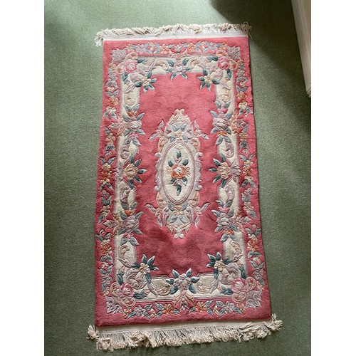 94 - Good size Chinese pink ground floor carpet / rug together with a smaller similar 
.