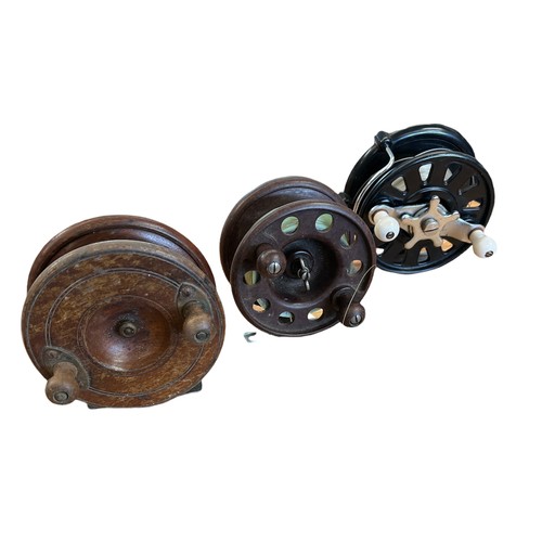 106 - Three fly-fishing reels including a bakelite Modernite Pixie and two others. Inside lot 101