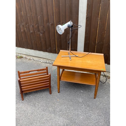 129 - A mid-century teak occasional table, magazine rack and a spot lamp