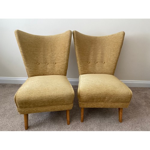 133 - A pair of mid-century stylish high backed chairs (Purchaser will need to re-upholster to conform wit... 