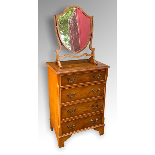 242 - Small reproduction yew wood finish 4 drawer chest and a similar antique style sheild mirror.