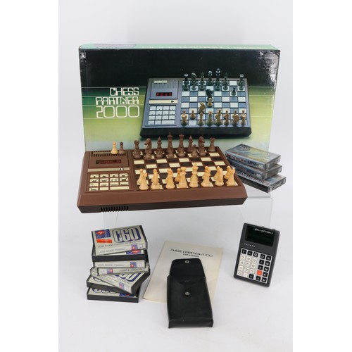 240a - Chess partner 2000, VATMAN II calculator and a quantity of unused tape cassettes.