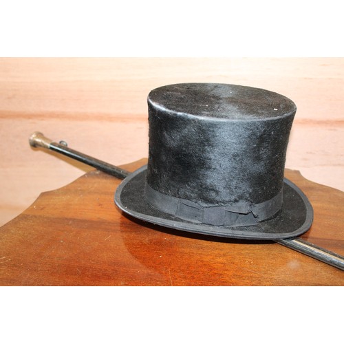 147 - Silver topped cane and a silk top hat by Cleverley's