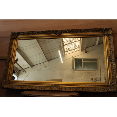 238 - Large mirror in gilt frame measuring approx 145cm x 83cm