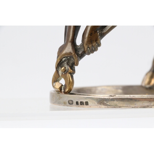 12 - A bronze fawn pulling a tack out of a silver hallmarked horseshoe