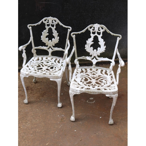 6 - Two cast garden chairs.