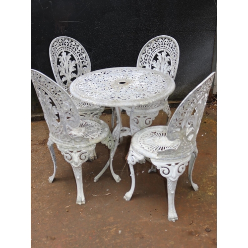 7 - Circular aluminium garden table with four chairs.
