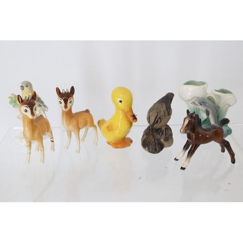 55 - A Poole bird, Beswick foal and two 