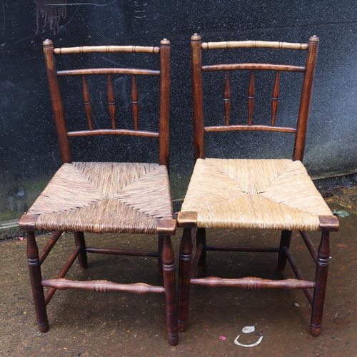 65 - Set of four rush seat rustic chairs with turned support and bamboo style top rail (two shown)