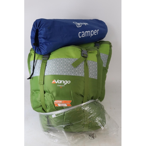 69 - Two Vango Starlight SQ sleeping bags together with a Higear inflatable ground mat and a selection of... 