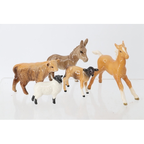 99 - Collection of Beswick animals to include a prancing foal, Donkey, lamb, Ewe and a calf