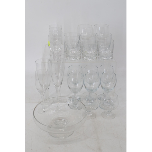 100 - A quantity of assorted Dartington glassware including tumblers, wine glasses, champagne flutes, bowl... 
