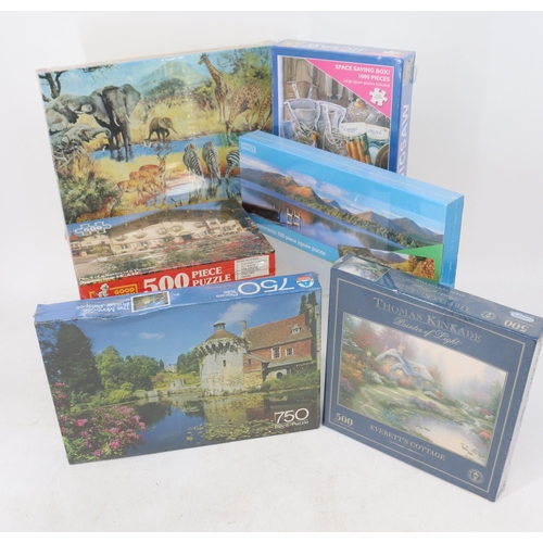 111 - Six new and sealed jigsaw puzzles inside Lot 108