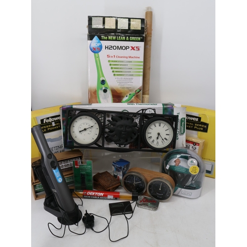 132 - A mixed lot containing clock and barometer, steam mop, headphones etc.. TRADE - SPARES OR REPAIRS in... 