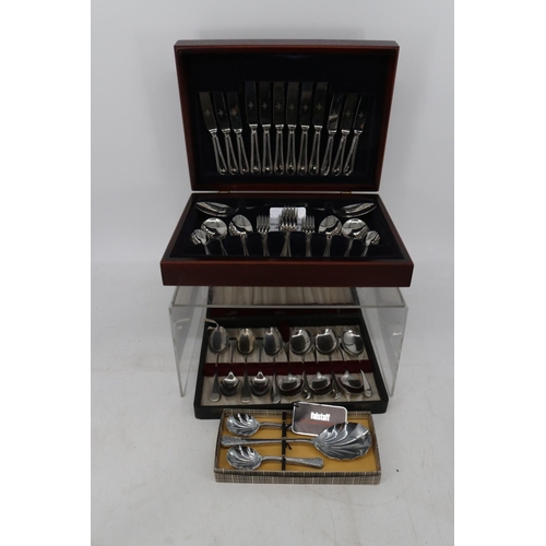 240 - Canteen of cutlery, cased cutlery sets, plated wine coaster etc