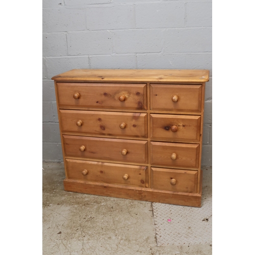 244 - A pine bank of drawers with four to the left and four smaller to the right. It measures approx' 124W... 