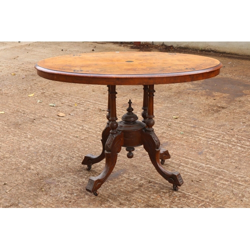 283 - Small Victorian walnut tilt top table, Inlaid satinwood and ebony on four legged base.