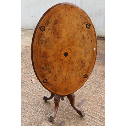 283 - Small Victorian walnut tilt top table, Inlaid satinwood and ebony on four legged base.