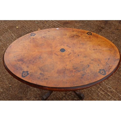 283 - Small Victorian walnut tilt top table, Inlaid satinwood and ebony on four legged base.