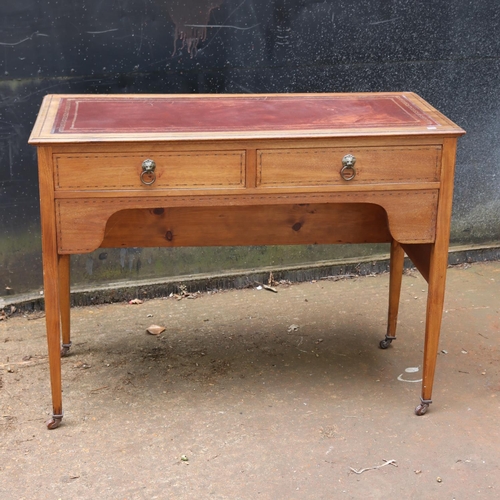 291 - Two drawer desk faded leather to top measuring approx 106cm x 47cm x 79cm