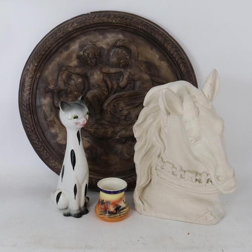 313 - Plaster horses head measuring approx 40cm together with a plaster plaque featuring Cherubs measuring... 