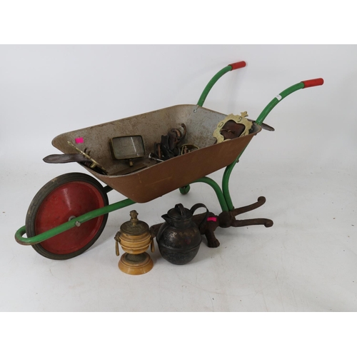 320 - A child's wheelbarrow with other metal items, bootjack etc..