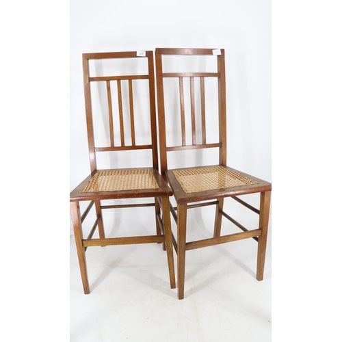 277 - Two cane seat chairs together with two upholstered chairs