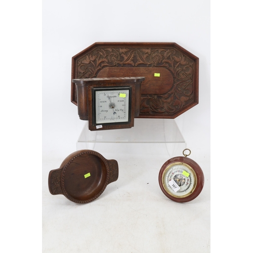 307 - A selection of wooden items including tray and two barometers.