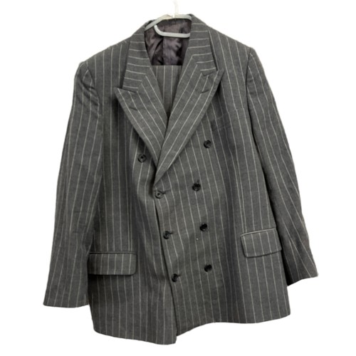 143A - A collection of vintage suits. A tailored double-breasted pinstripe (approx 36