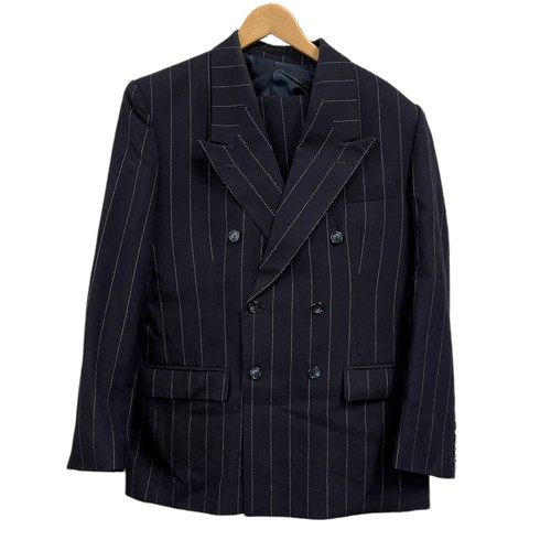 143A - A collection of vintage suits. A tailored double-breasted pinstripe (approx 36