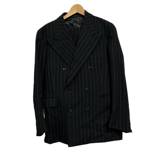 143A - A collection of vintage suits. A tailored double-breasted pinstripe (approx 36