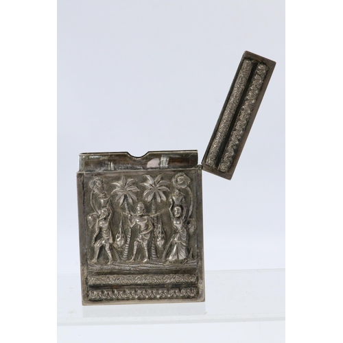 26 - Eastern white metal card holder decorated with raised figural detail, elephants etc.