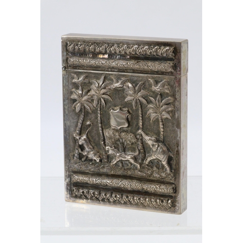 26 - Eastern white metal card holder decorated with raised figural detail, elephants etc.