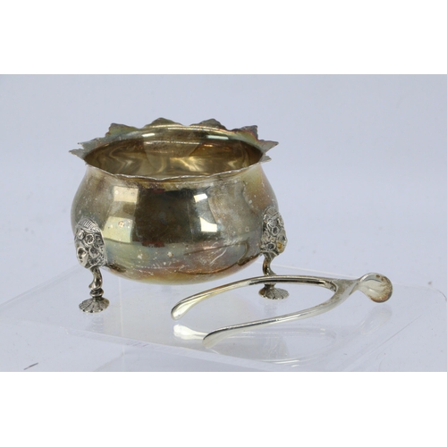 7 - Silver three footed sugar bowl and a pair of wishbone tongs approx. 100g