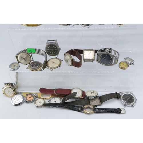 108 - A tin of assorted vintage and later wristwatches for spares and parts