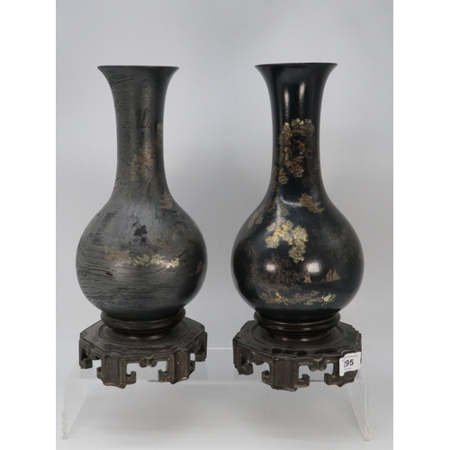 295 - Pair of lacquered Japanese vases on fixed stands. 30cms tall.