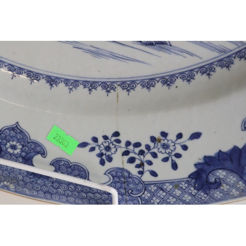 461 - A large chinese blue and white charger/plate (approx. 55cm diameter) noted hairline cracks to the ed... 