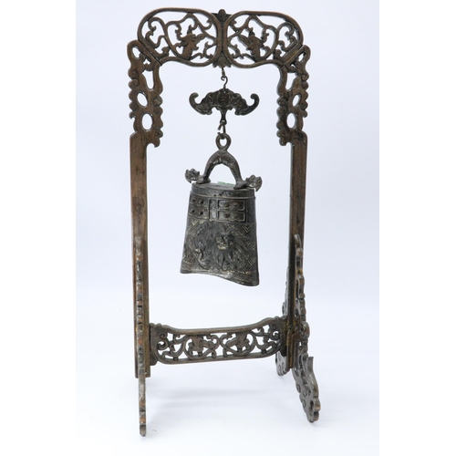 634 - Oriental bell on hardwood stand approx 17