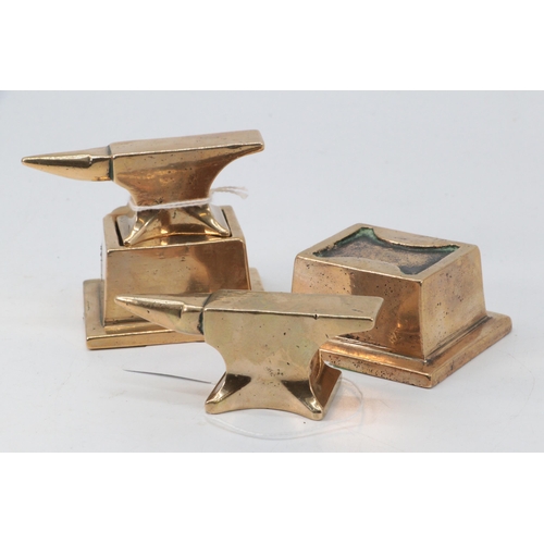 102 - Two bronze? jewellers anvils on stands/bases