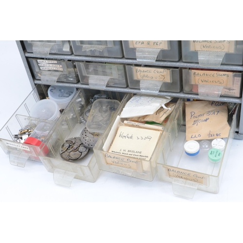 391 - Metal storage tidy drawer set, with watch interest contents, mainy balance staffs etc