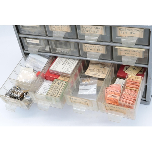 391 - Metal storage tidy drawer set, with watch interest contents, mainy balance staffs etc