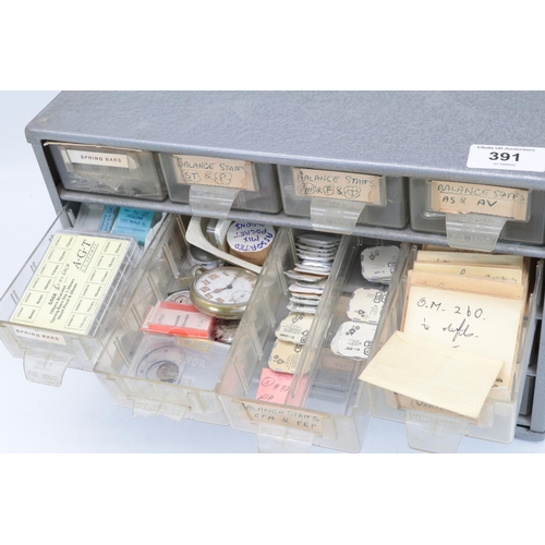 391 - Metal storage tidy drawer set, with watch interest contents, mainy balance staffs etc